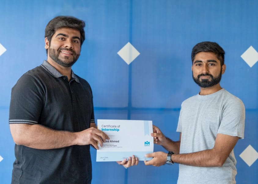 Umer Farooq (Chief Technology Officer) handing over the completion certificate to the intern, Osaid Ahmed - MRS Summers Internship Program | MRS Technologies Pakistan