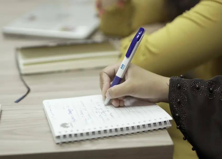 An Intern making notes during knowledge session - MRS Summers Internship Program | MRS Technologies Pakistan