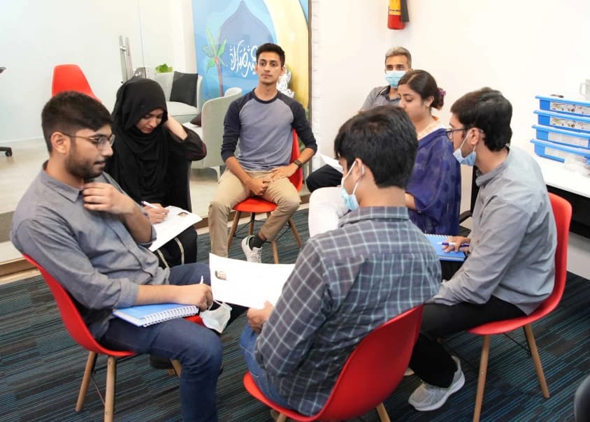 Interns from MRS Internship program 2022 collaborating over group activity - MRS Summers Internship Program | MRS Technologies Pakistan